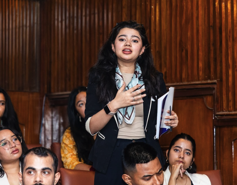 Sita K. speaking at a forum